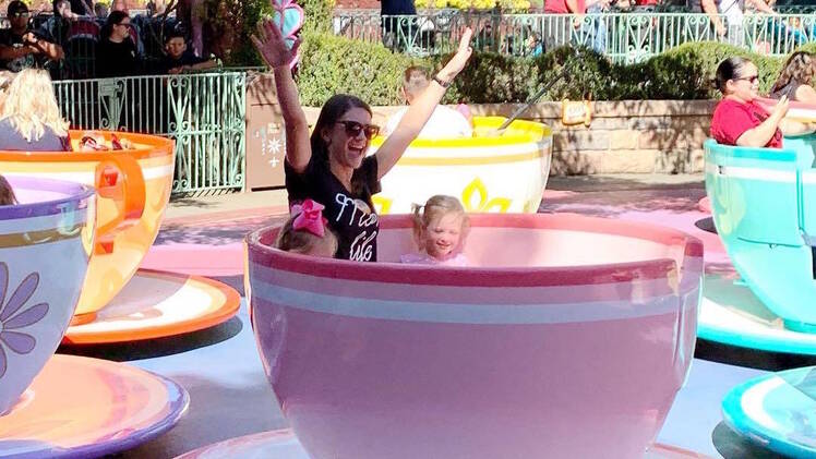Danielle Busby And Daughters Ride Spinning Teacups At Disneyland