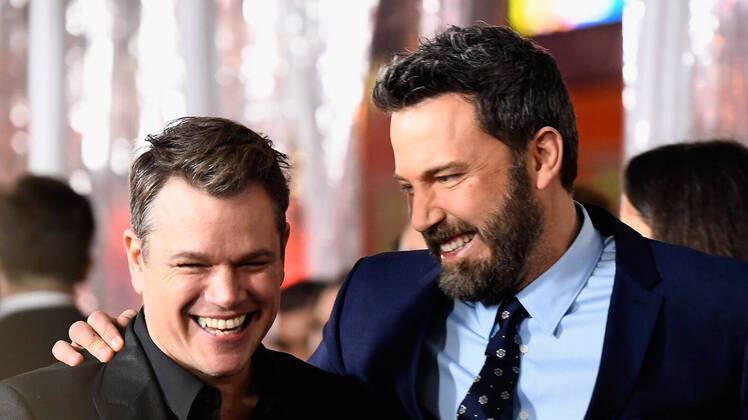 Ben Affleck and Matt Damon laughing at each other