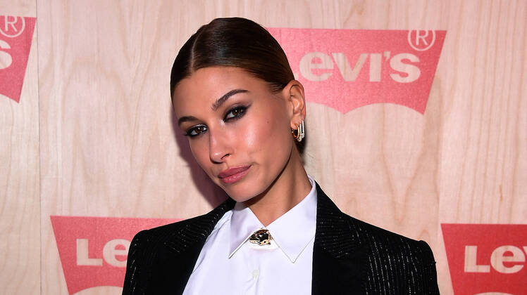 Hailey Baldwin wearing a white shirt at a NYC event