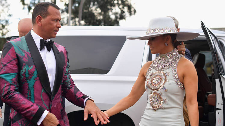 alex rodriguez wearing a patterned suit with jennifer lopez