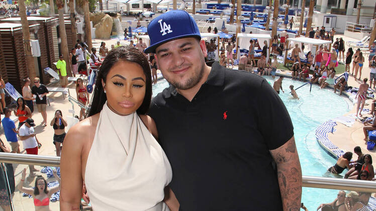 rob kardashian at a pool party with blac chyna wearing a white dress
