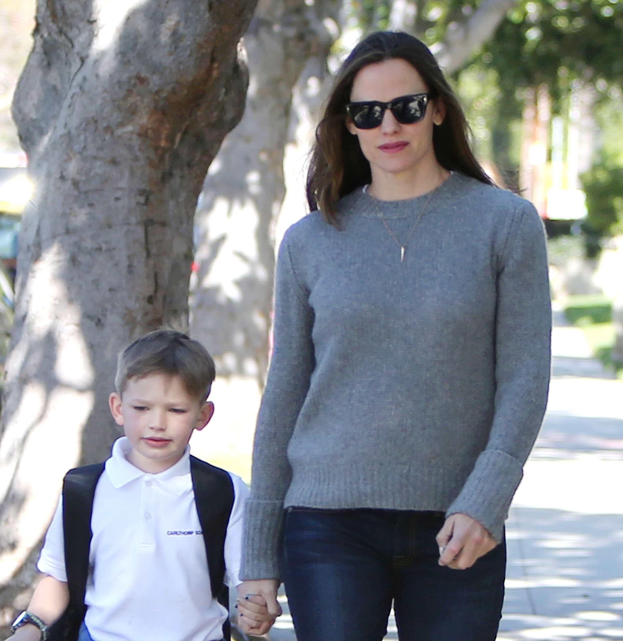 Jennifer Garner gives her son Samuel a piggyback ride after picking him up  from school in Brentwood