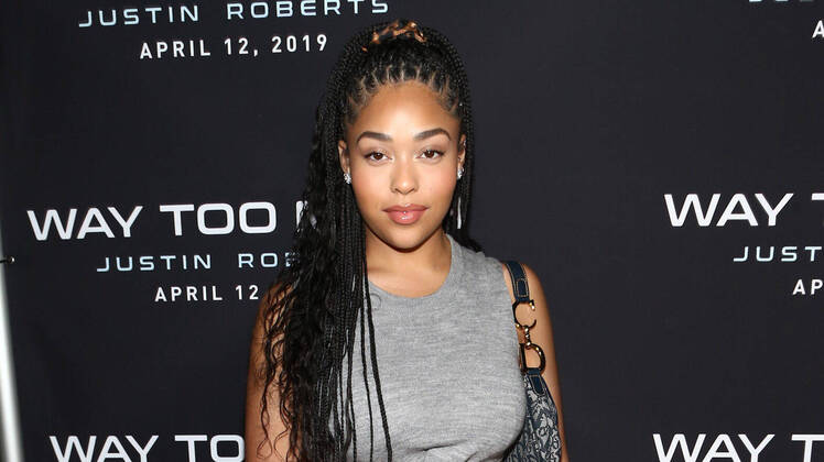 Jordyn Woods wearing a Gray Dress at a Premiere Party in LA