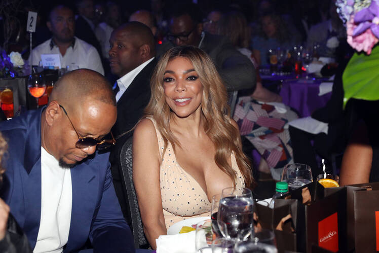 Wendy Williams Wearing a Tan Dress with Kevin Hunter in Sunglasses