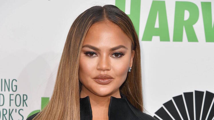 Chrissy Teigen Wearing a Black Outfit at an Event