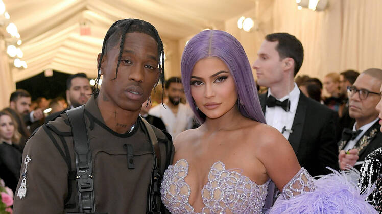 Kylie Jenner Travis Scott met gala 2019 purple hair outfits purple feathered dress military suit