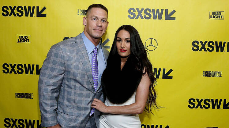 Nikki Bella Wearing a White Background With Ex John Cena in a Suit