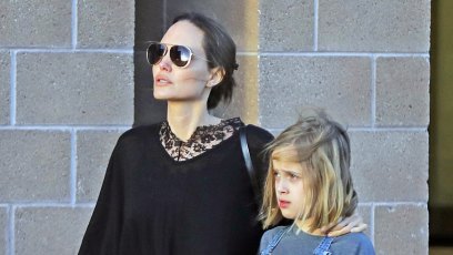 Angelina Jolie showers twins Vivienne and Knox with kisses and cuddles