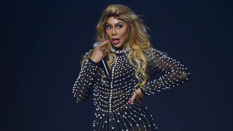 Tamar Braxon on Stage Wearing a Sparkly Dress