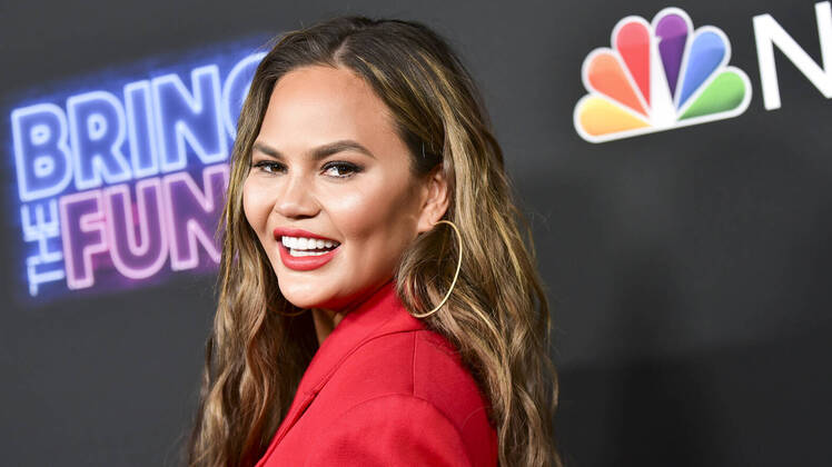 Chrissy Teigen Wearing a Red Outfit