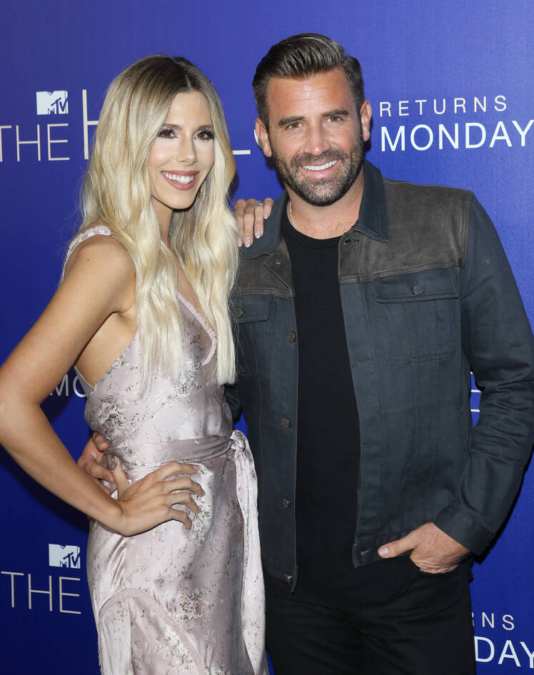 Ashley Wahler Wearing a Silver Dress With Jason Wahler