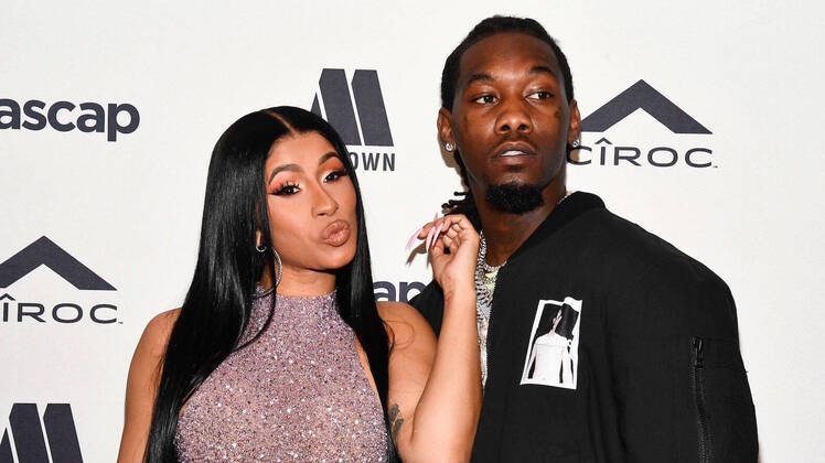 Cardi B Touching Offset's Face on a red Carpet