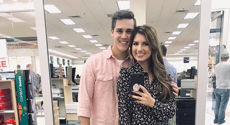 Carlin Bates and Evan Stewart Take Mirror Selfie in Store