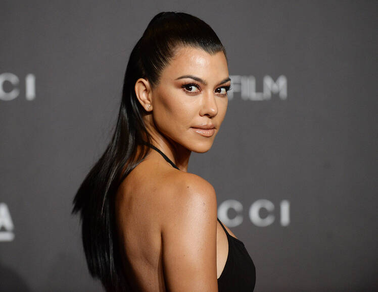 Kourtney Kardashian Claps Back at Hater Who Says She Doesn't Read