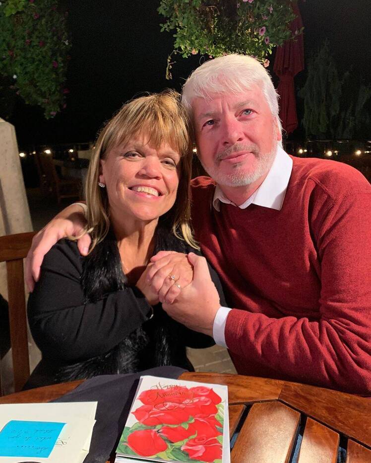 amy roloff and chris marek showing off engagement ring