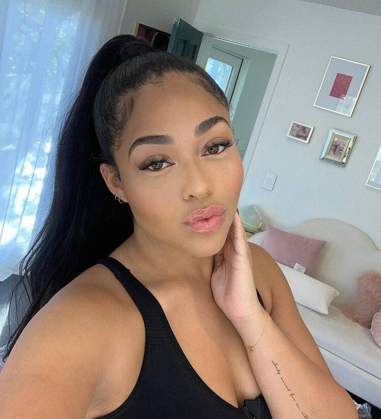 Jordyn Woods Wearing a Ponytail and a Black Shirt