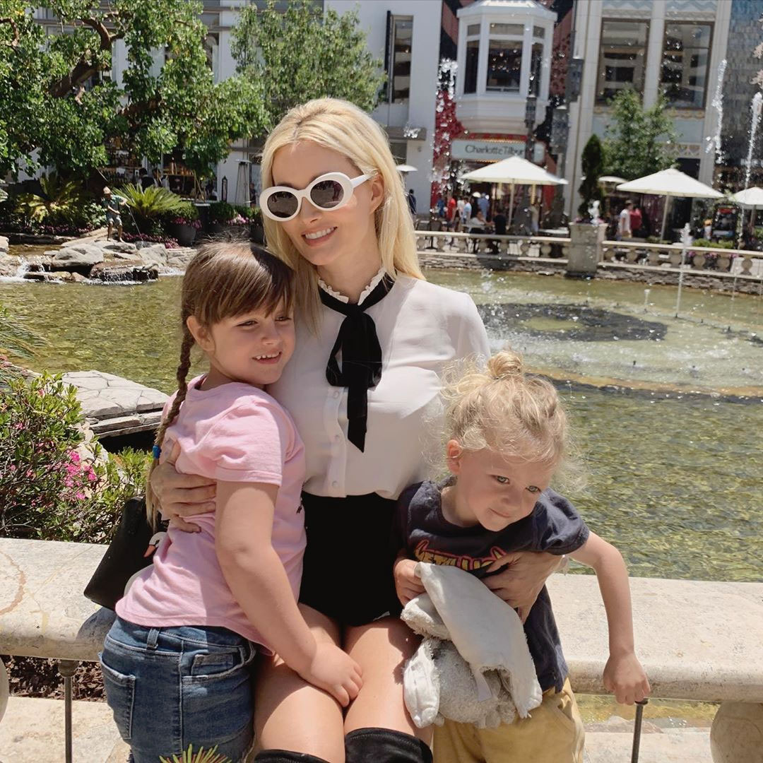 Holly Madison shows off her baby bump after Kendra Wilson declares 'war' on  her