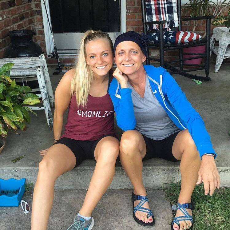 mackenzie mckee and her mom angie douthit sitting on a porch