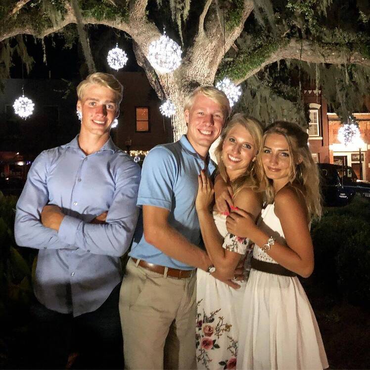 micah, ethan, olivia and moriah plath posing in the dark