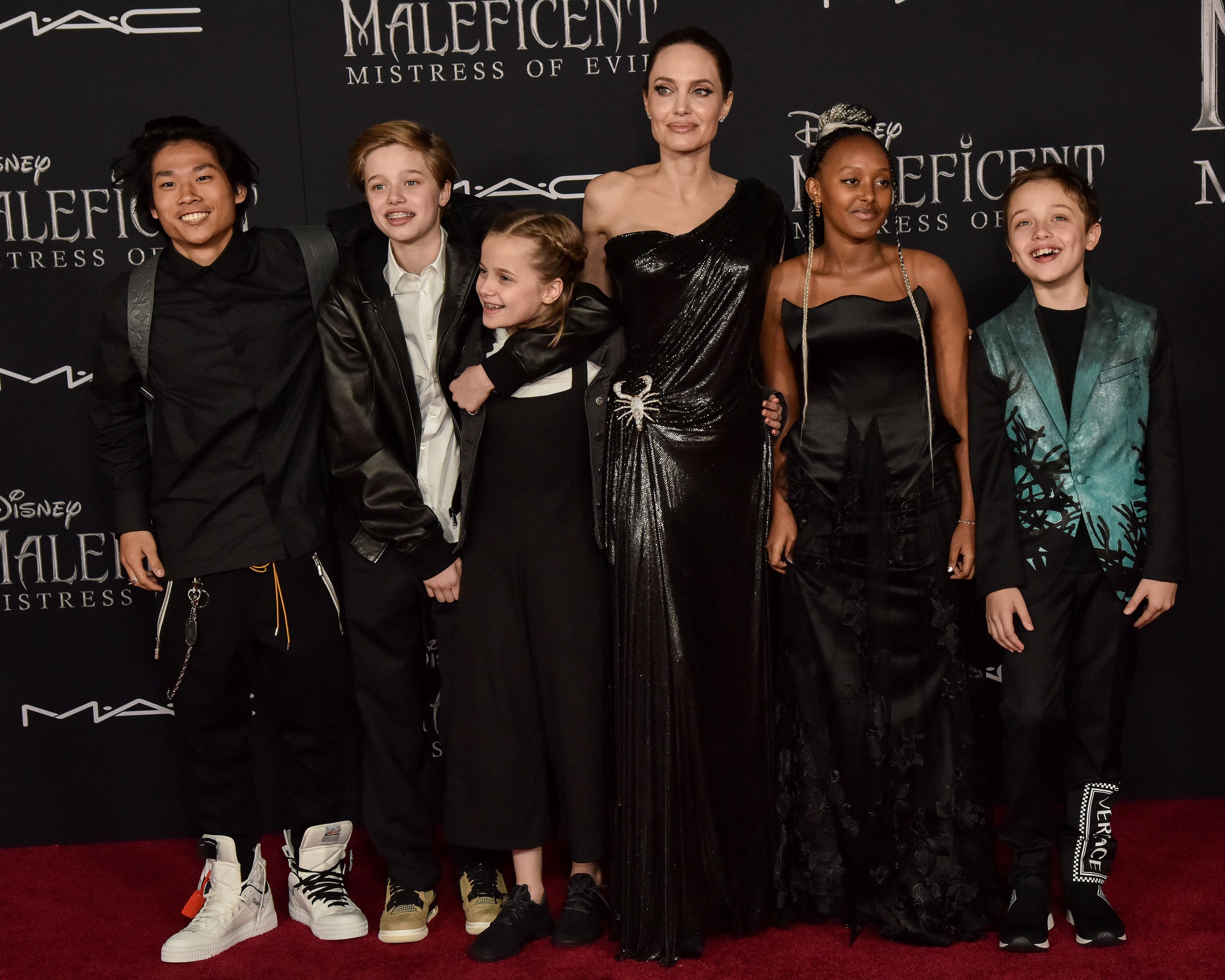 Angelina Jolie And Brad Pitts Son Paxs Transformation In Photos