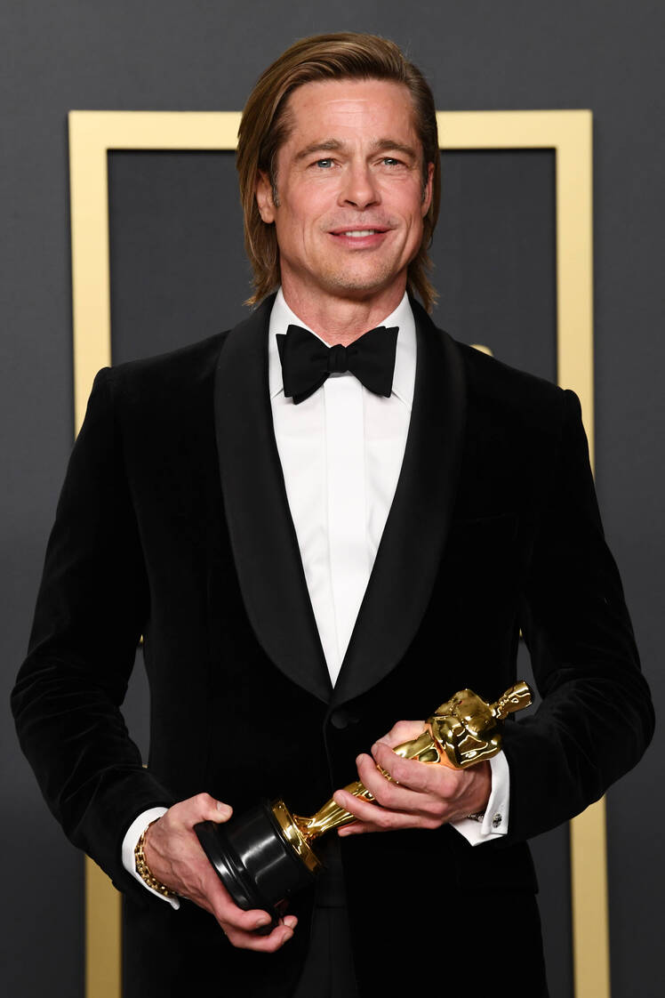 Brad Pitt Holding His Trophy at the Oscars