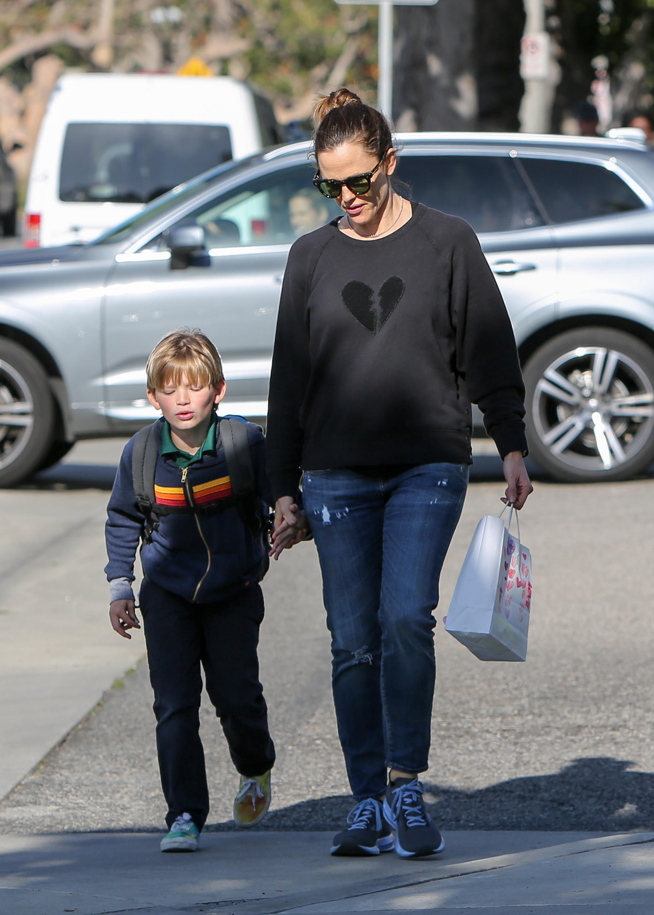 Jennifer Garner gives her son Samuel a piggyback ride after picking him up  from school in Brentwood