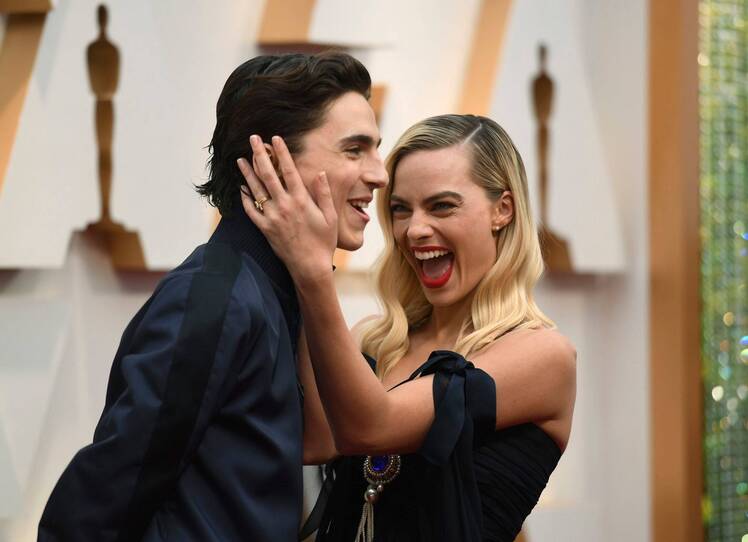 Margot Robbie Hugging Timthoee chalamet