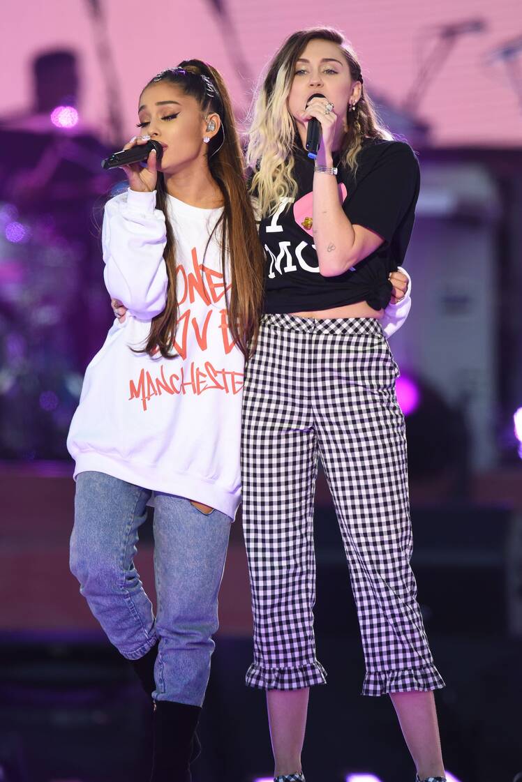 Miley Cyrus and Ariana Grande Wrap Their Arms Around Each Other While Performing on Stage