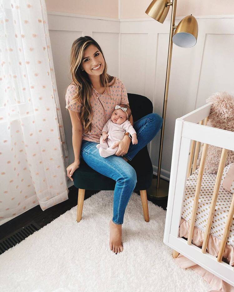 Carlin Bates Holding Daughter Layla