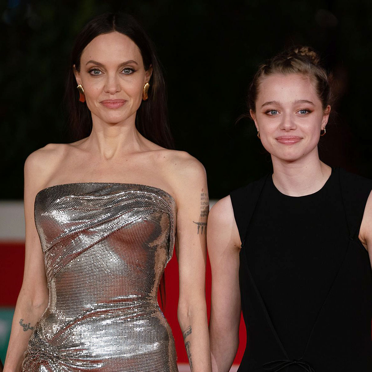 Angelina Jolie holds hands with daughter Zahara, 17, in Rome
