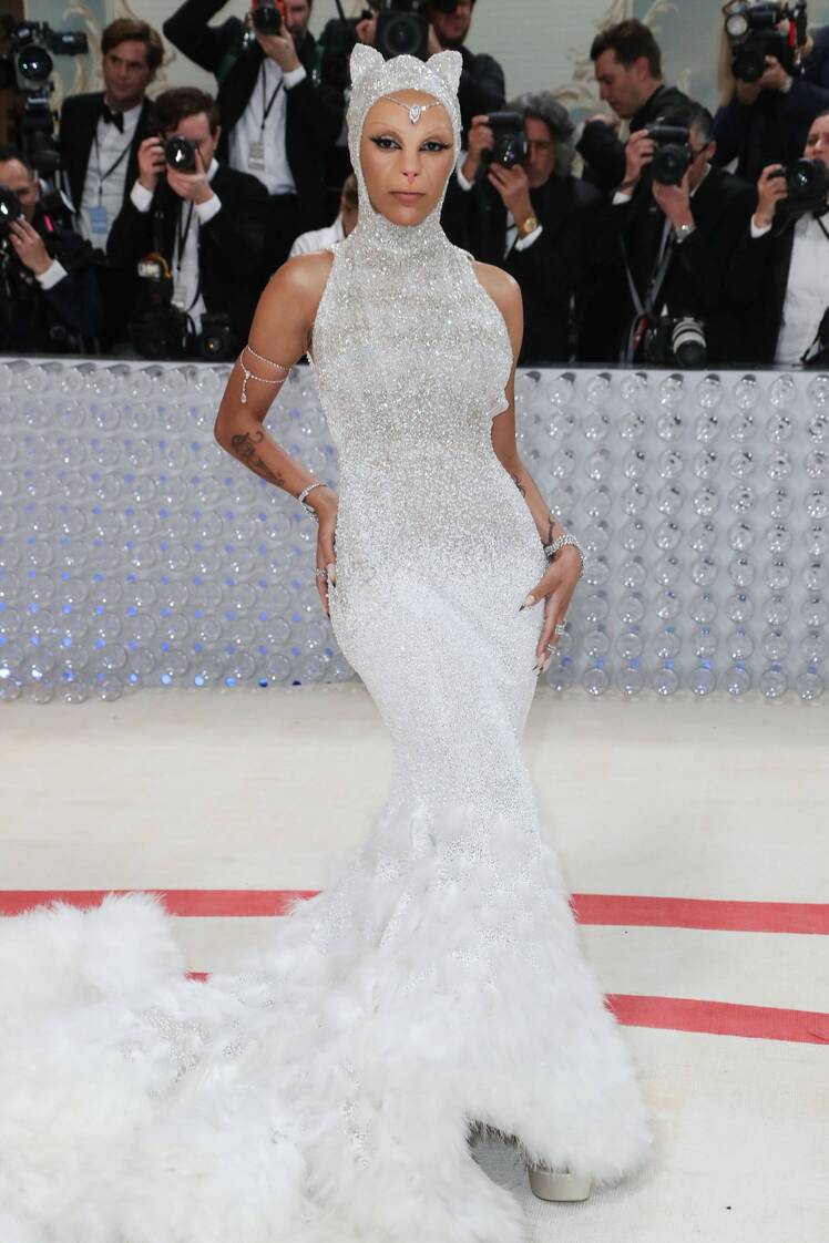 Doja Cat wears white dress and cat prosthetics at the Met Gala 2023