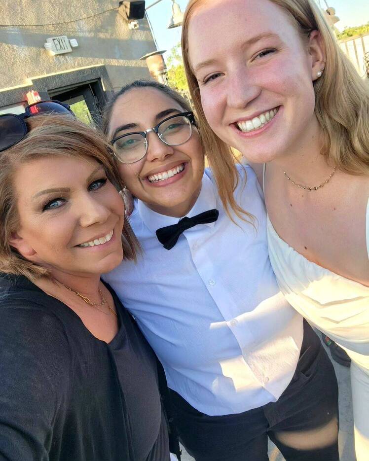 Meri Brown posing for a selfie with Beatriz Quieroz and Gwendlyn Brown