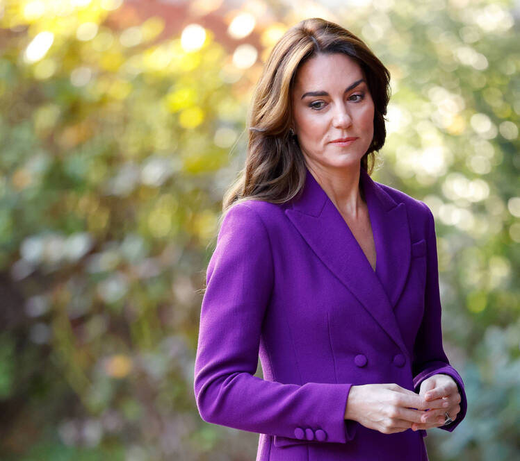 Kate Middleton wearing a purple ensemble