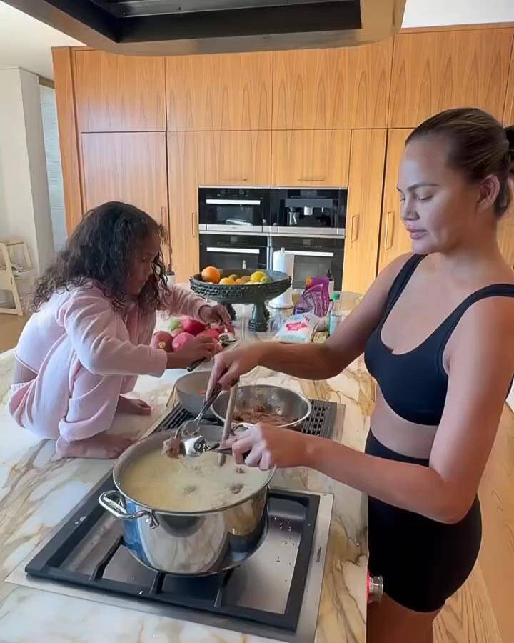 Chrissy Teigen Slammed by Fans for Video of Daughter Luna Cooking With Her Feet on Kitchen Countertop 0249