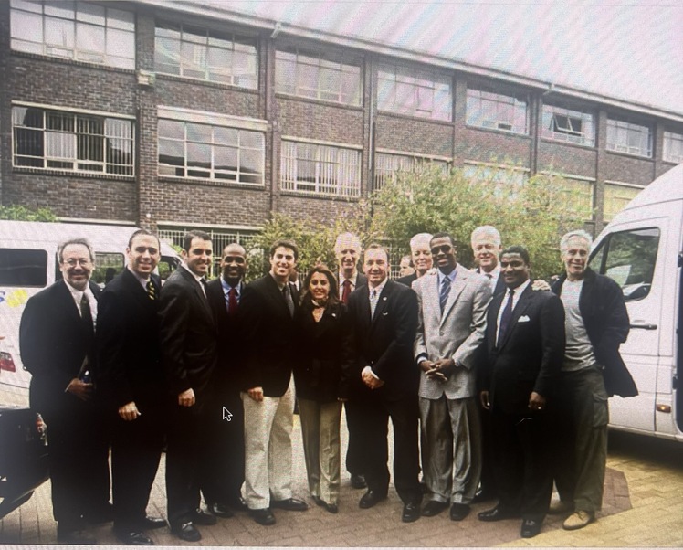 In a newly uncovered photo, Wasserman (center, beige pants) smiles with a group that includes Kevin Spacey, former President Bill Clinton and Jeffrey Epstein (far right).