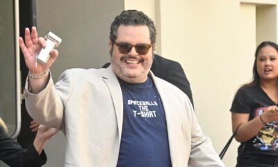 Josh Gad waves to cameras outside San Diego Comic Con.
